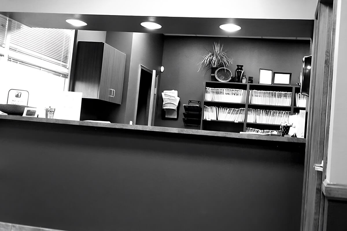 ABA provider receptionist desk with medical files on the shelves behind