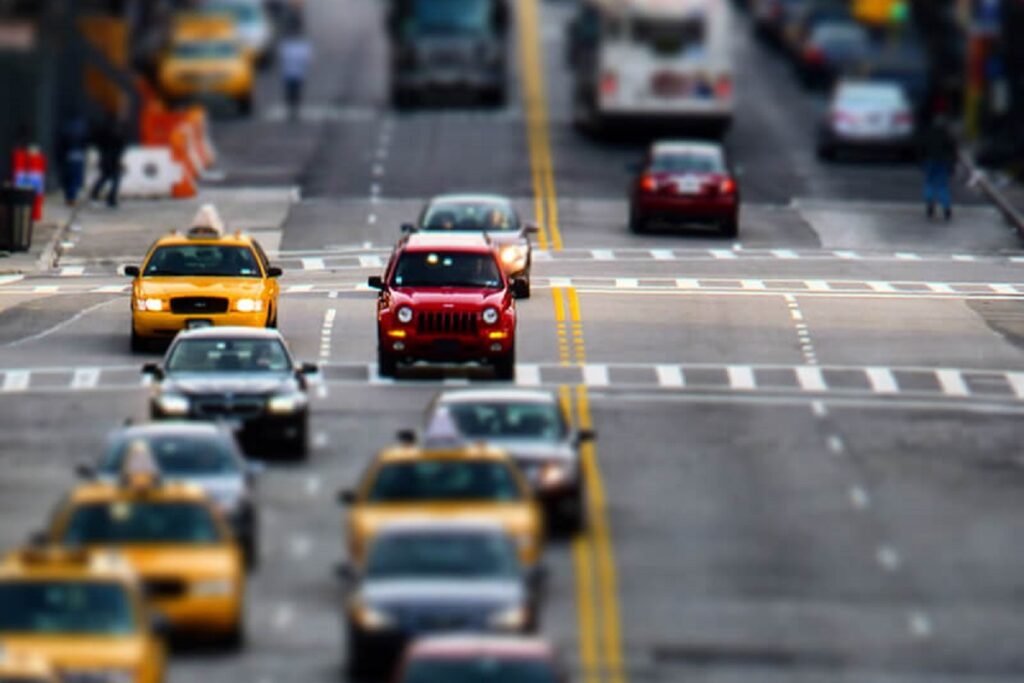 Telephoto shot of a New York road with lots of traffic blurred to give a toy or miniature effect