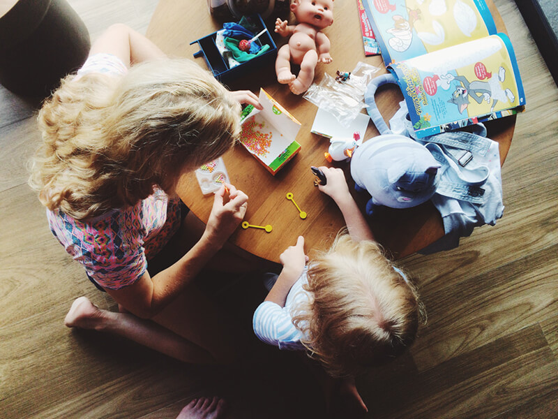 Mother and child playing with toys