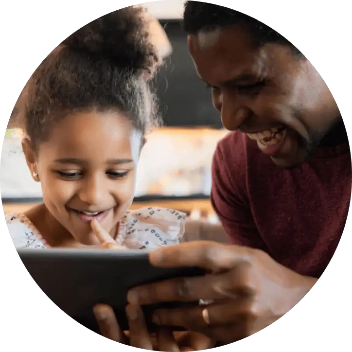 african american father with daughter using smartphone