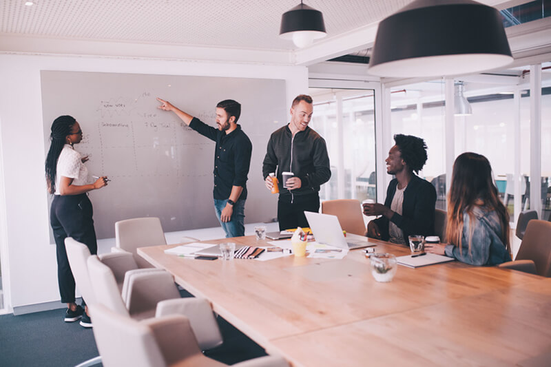 Employees in meeting room