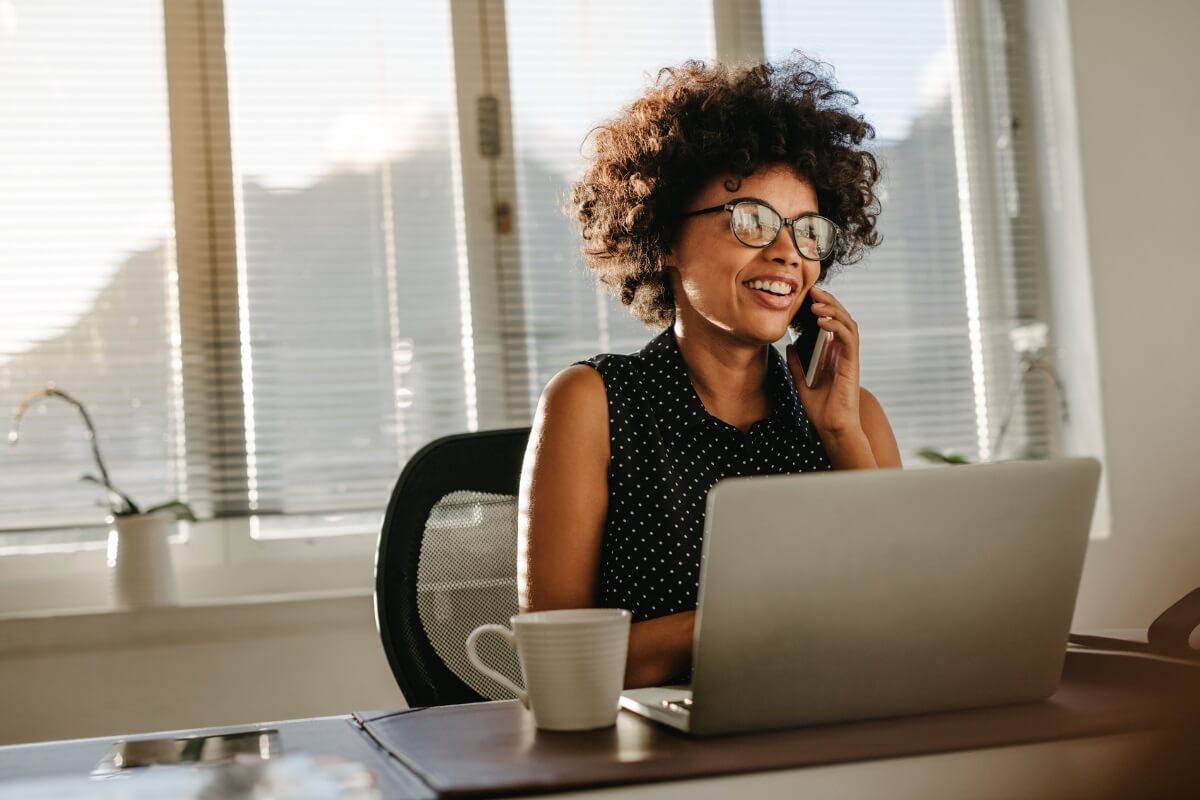 African American female ABA therapy practice owner on phone