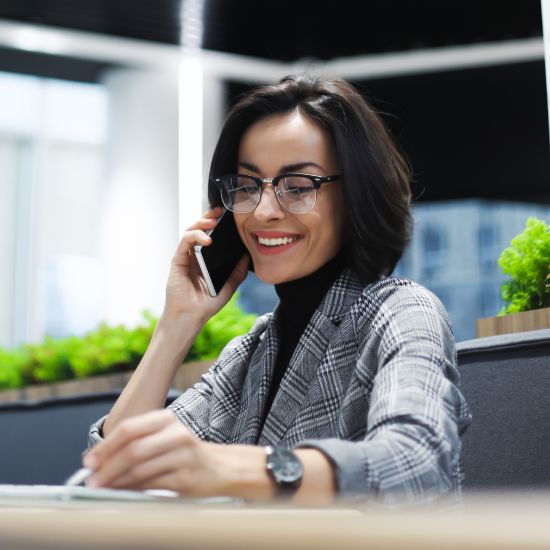 Female in glasses scheduling an appointment