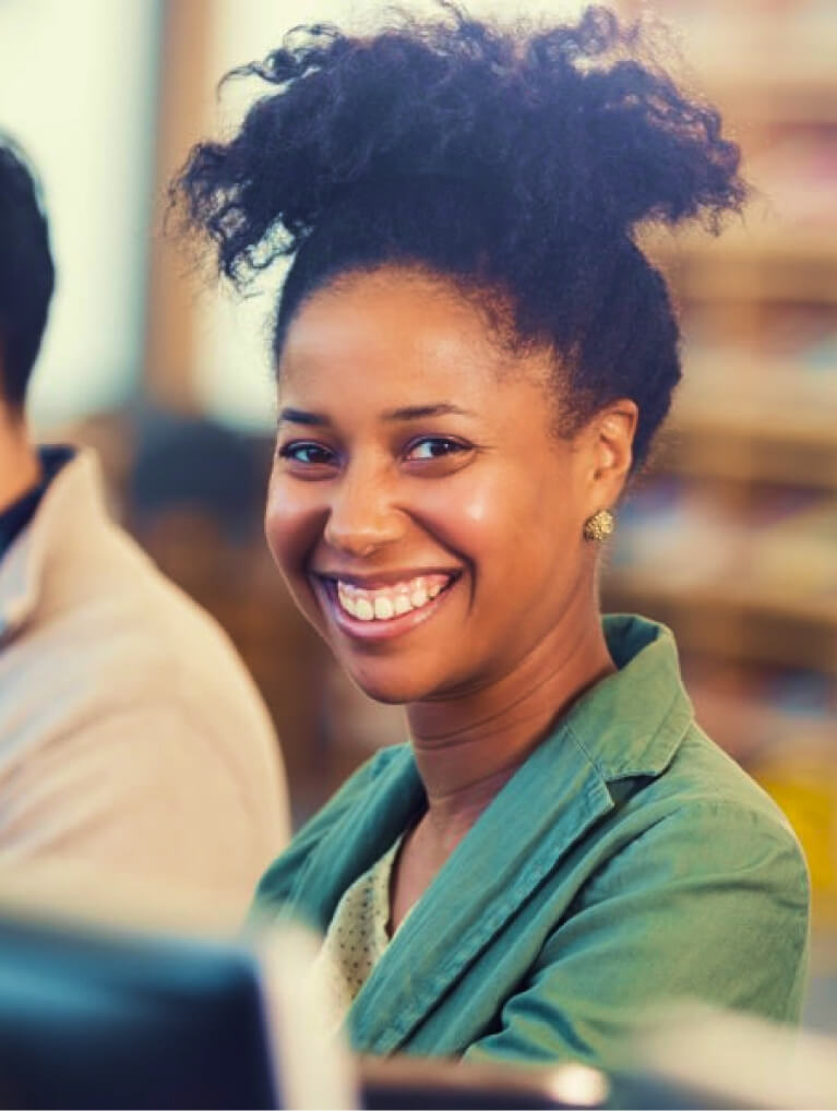 Female African American BCBA smiling taking quiz for enhanced learning retention