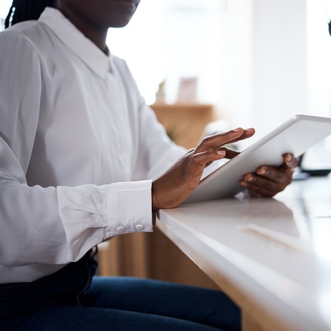 ABA woman using data collection on tablet in modern office